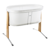 A BabyBjörn Cradle in White with a light natural wood frame and silver metal support legs, shown on a plain white background.
